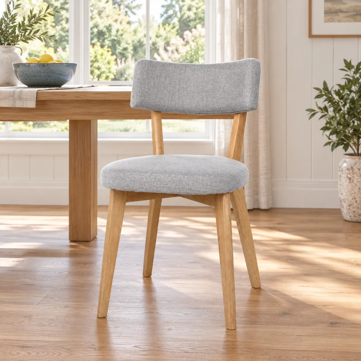 AH-8150 grey fabric dining chair with wood frame in a family dining room